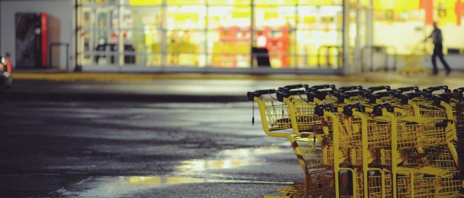 Yellow shopping carts on concrete ground